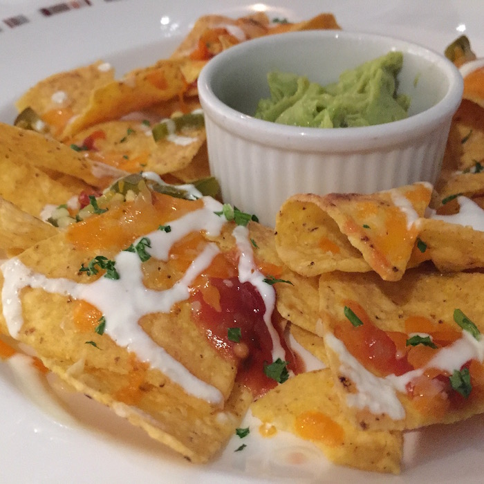 Beach House Nachos with salsa, guacamole and sour cream